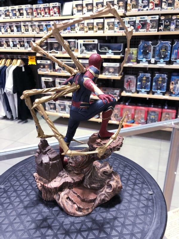Load image into Gallery viewer, Photo of Iron Spider Spider-Man Gallery Statue by Diamond Select Toys. Spider-Man is posed on a rock formation in his Iron-Spider suit as seen in Avengers: Infinity War.  Photo shows the back of the statur
