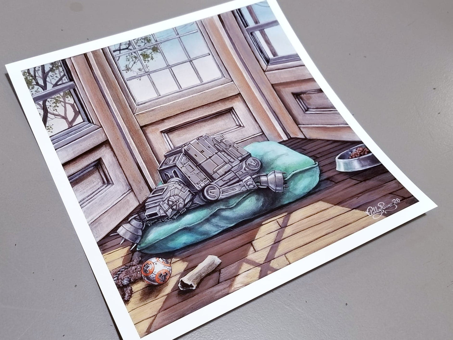 Load image into Gallery viewer, &amp;quot;Imperial Pupper&amp;quot; Star Wars Parody Art Print by Ashley Raine  Who&amp;#39;s a good AT-AT? This boy is, and he&amp;#39;s taking a well deserved puppy nap by the window! This Star Wars parody art is perfect for Imperial War Machine lovers and Sith Sympathizers of course, but also for any Star Wars fan who loves their fur-babies!    Details to Enjoy: Pup has a Wookiee toy with a torn-off arm, a bone, a comfy bed, and a well loved BB-8 chewy toy for only the best of good boys.
