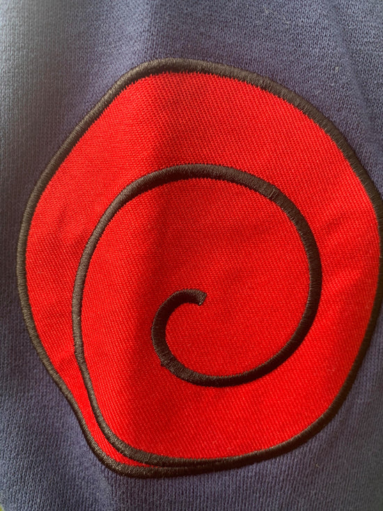 Load image into Gallery viewer, Officially Licensed Naruto Shippuden Military Style Kakashi Hoodie — a cozy zipper sweatshirt with incredible detail work including the Leaf Village emblem and the red swirl Uzumaki Clan Symbol.    Officially Licensed 60/40% Cotton Polyester Machine washable
