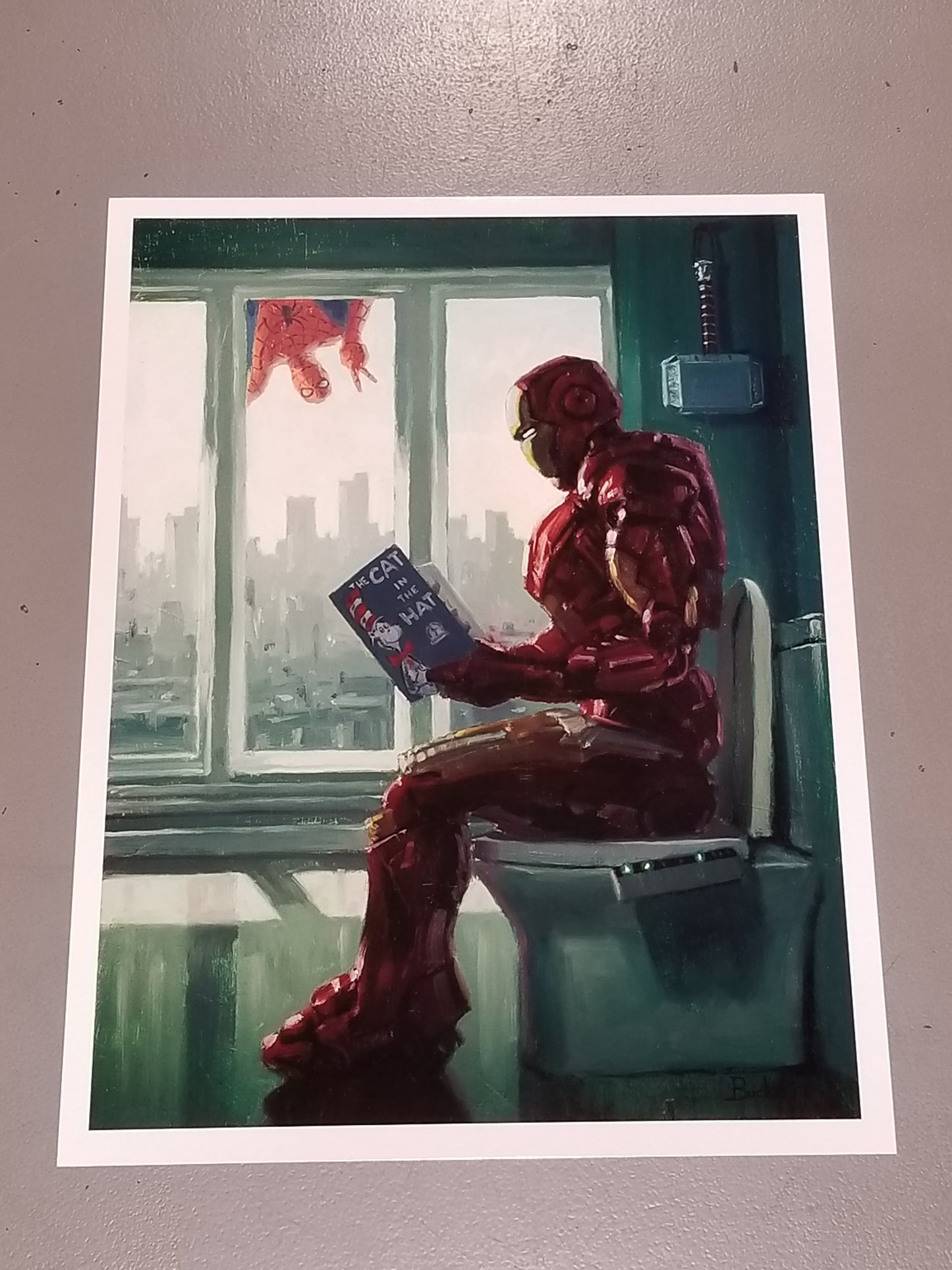 "I need it." - Tony Stark  Iron Man Marvel Parody Art Print by Bucket Art.  Cool Things: ﻿Thor's Hammer hanging on wall, Spider-Man photo bombing, Iron Man is reading "Cat in the Hat."  ﻿Did You Know? ﻿Tom Holland signed the Original & owns a canvas.   Print Size: 16" x 12" on Premium Archival Paper