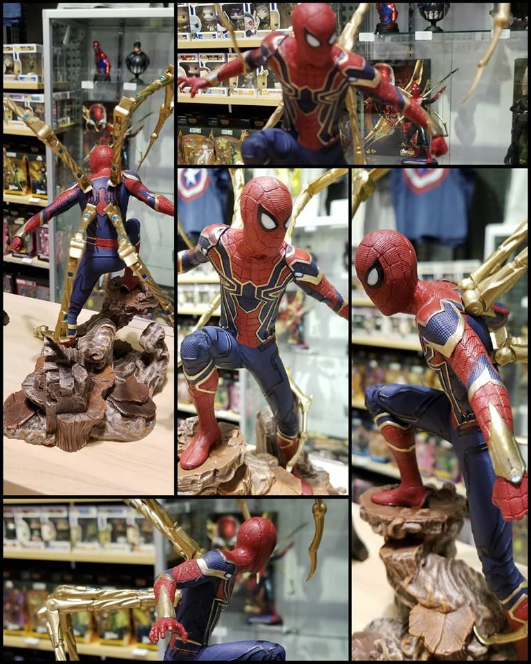 Load image into Gallery viewer, Photo collage of The Iron Spider Spider-Man Gallery Statue by Diamond Select Toys. Spider-Man is posed on a rock formation in his Iron-Spider suit as seen in Avengers: Infinity War
