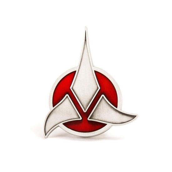 Star Trek Klingon Emblem Wearable Magnetic Badge  This symbol strikes terror across the Alpha Quadrant and signifies the uniting of the Klingon peoples into a mighty empire. It originated in the times of the ancient hero, Kahless and his conquests. Made of a hefty zinc alloy and inlaid with red enamel, this 2-inch quality badge of the emblem of the Klingon Empire can be worn proudly by any honorable warrior.