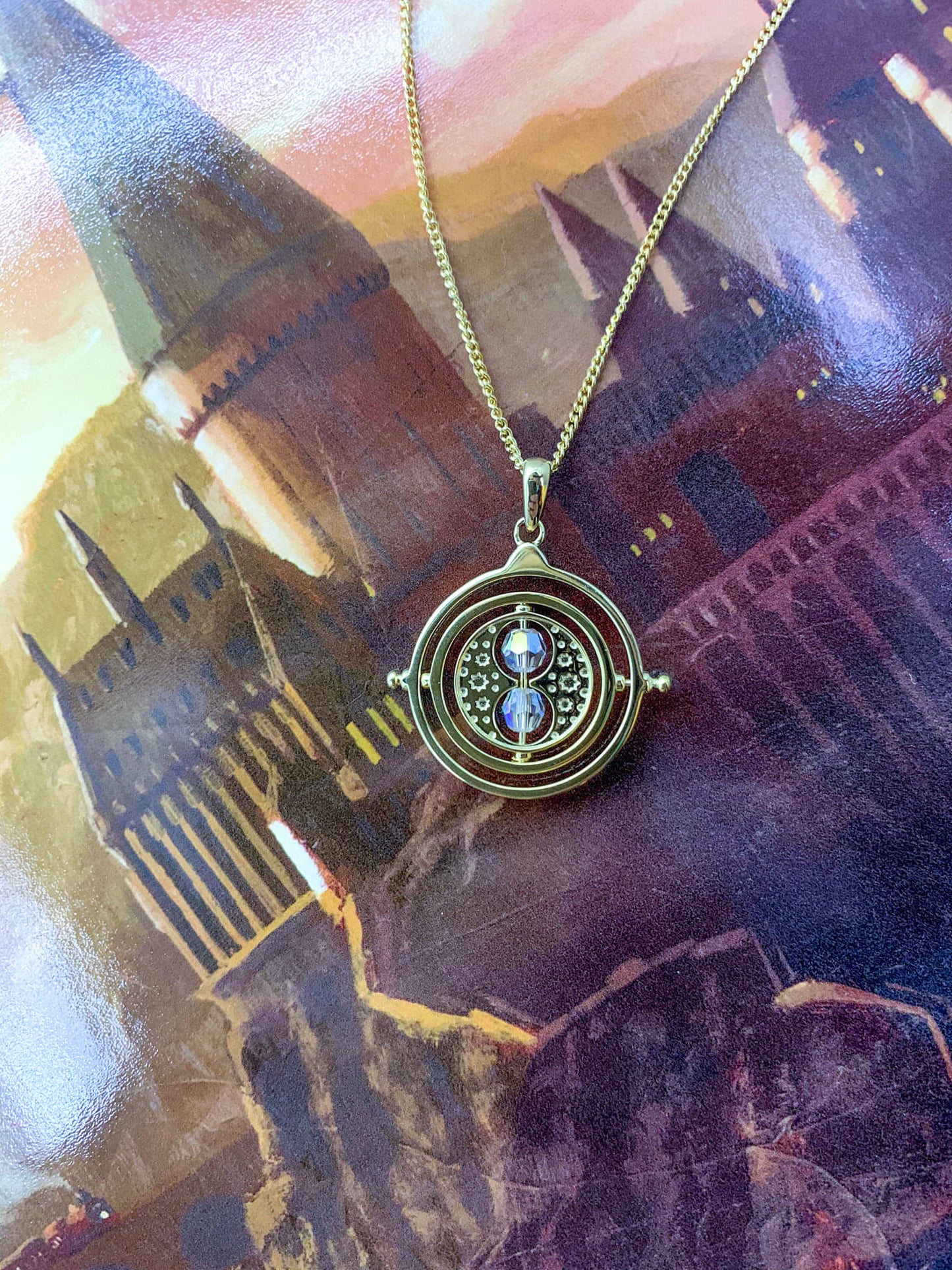 Load image into Gallery viewer, Time Turner (Harry Potter) Spinning Gold Plated Necklace with Crystals
