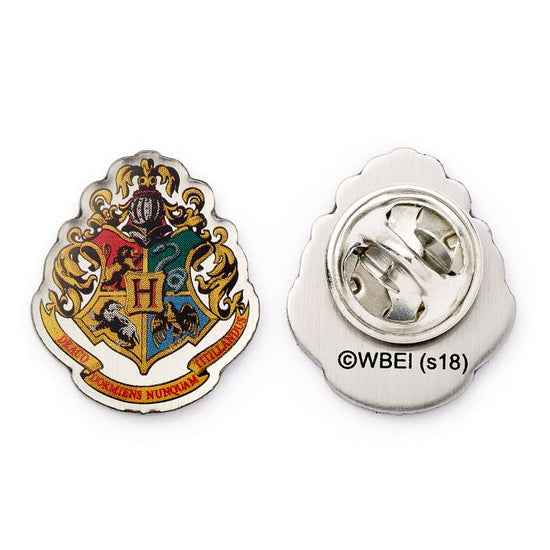 Official Harry Potter Hogwarts Crest Pin Badge  The Crest of the famous School of Witchcraft and Wizardry  This Harry Potter Pin Badge has been created using the official style guide from Warner Bros.  Enamel Pin Details:  Around .75" tall and .5" wide (20mm x 16mm) Beautiful colors protected by a high-gloss finish Enamel pin arrives on a printed Harry Potter card backer Quality metal badge pin with butterfly clutch backing