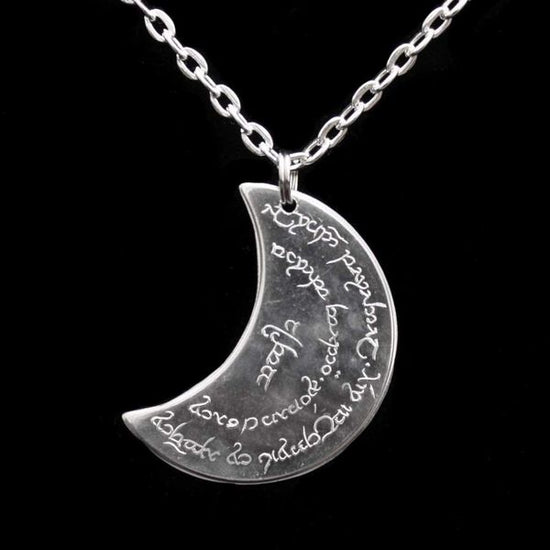 Elvish coin from Rivendell is shaped like a crescent moon. It depicts the valley containing the ancient trees of silver and gold and the three Silmarils, represented as stars. The text in Tengwar translates from Sindarin to Elrond Peredhil, Lord of Rivendell, The Last Homely House East of the Sea. It includes the date that Thorin and Company meet Elrond at Rivendell before continuing on to The Lonely Mountain.  This Rivendell Moon is crafted in celebration of The Lord of the Rings by J. R. R. Tolkien