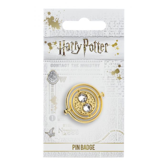 Load image into Gallery viewer, Fixed Time Turner Pin Badge  Worn by Hermione Granger, the Time Turner played a huge part in the Prisoner of Azkaban.  Please be aware that this fixed-pin design does not rotate. This Harry Potter Pin Badge has been created using the official style guide from Warner Bros.  Pin Details:  Around .75&amp;quot; tall and .5&amp;quot; wide (20mm x 16mm) Beautiful gold tone fixed-pin Time Turner with faux crystal bead detail Pin arrives on a printed Harry Potter card backer Quality metal badge pin with butterfly clutch backing  
