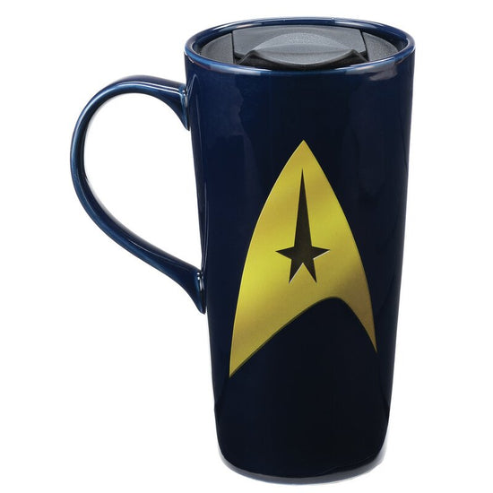 Don't leave the Enterprise for a mission without your favorite beverage! With this Star Trek Beam Me Up Scotty 20 oz. Heat Reactive Ceramic Travel Mug, you'll get to travel around with Captain Kirk on missions abroad.  Along with the words, "Beam me up, Scotty," this fantastic mug features a heat reactive design - when you add hot liquid, Captain James T. Kirk appears in the Transporter!  Holds up to 20 ounces of liquid. Heat reactive design changes when filled with hot liquid