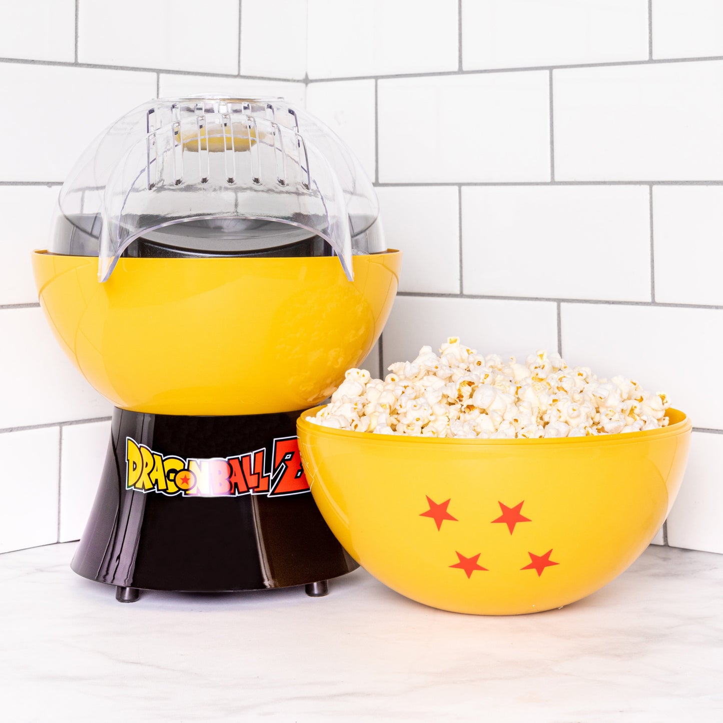 https://mycollectorsoutpost.com/cdn/shop/products/dragon-ball-z-dragon-ball-number-four-4-star-dragon-ball-anime-kitchen-goku-popcorn-maker_1445x.jpg?v=1645304998