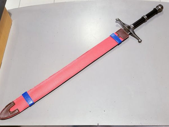 Trunks' Sword steel prop replica with sheath  — as wielded by Future Trunks in the Dragon Ball anime series, first featured in Dragon Ball Super.   Trunks' iconic orange and blue scabbard is included, making this replica feel straight from the anime series. This is a sturdy and high-quality prop replica, not intended for martial arts use. 